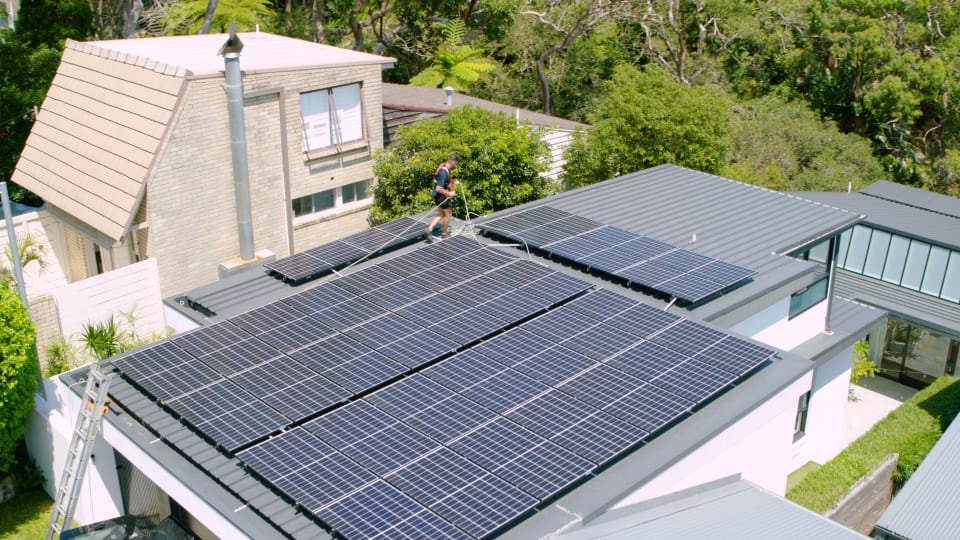 Solar panels being installed on a residential roof