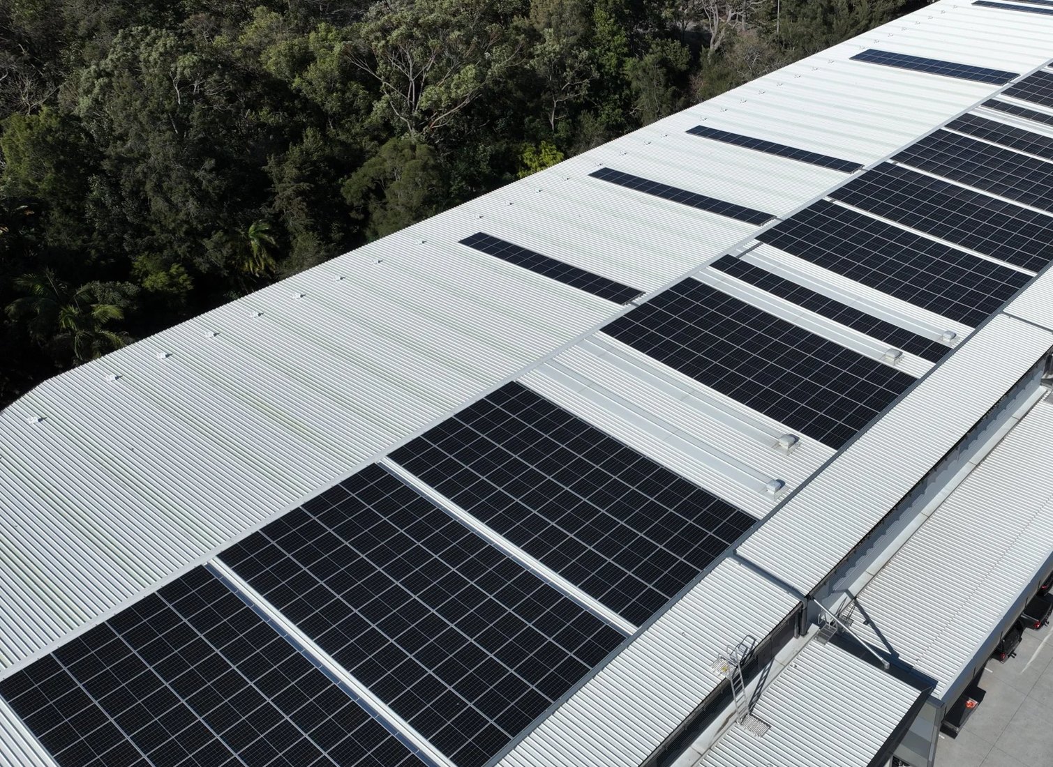 Close view of commercial rooftop solar arrays
